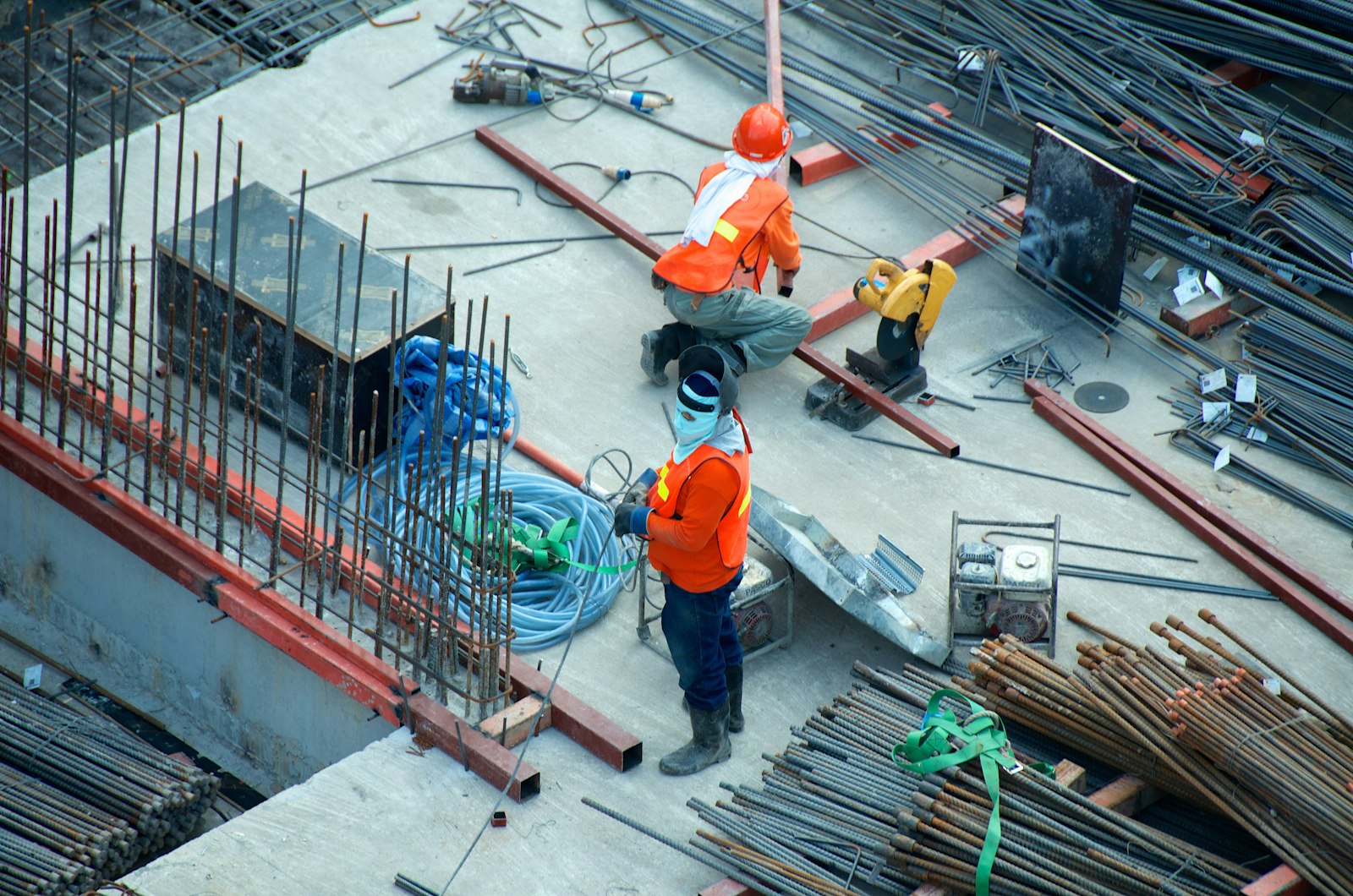 Construction site with workers and structural works