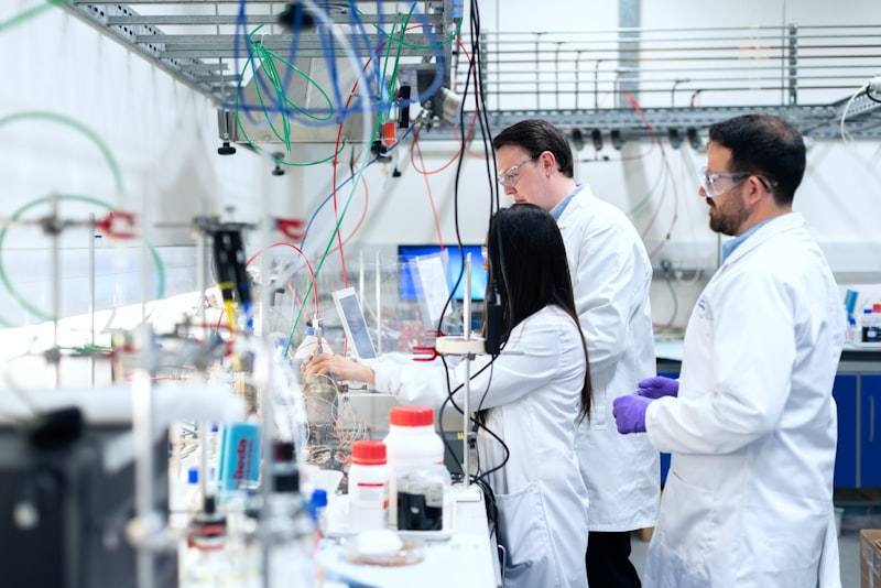 Technicians in coats working in a laboratory