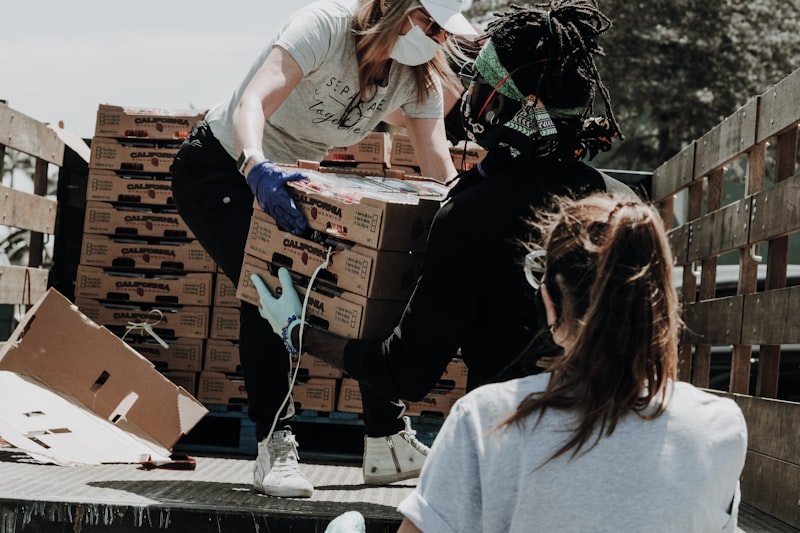 Workers packing cartons for dispatch